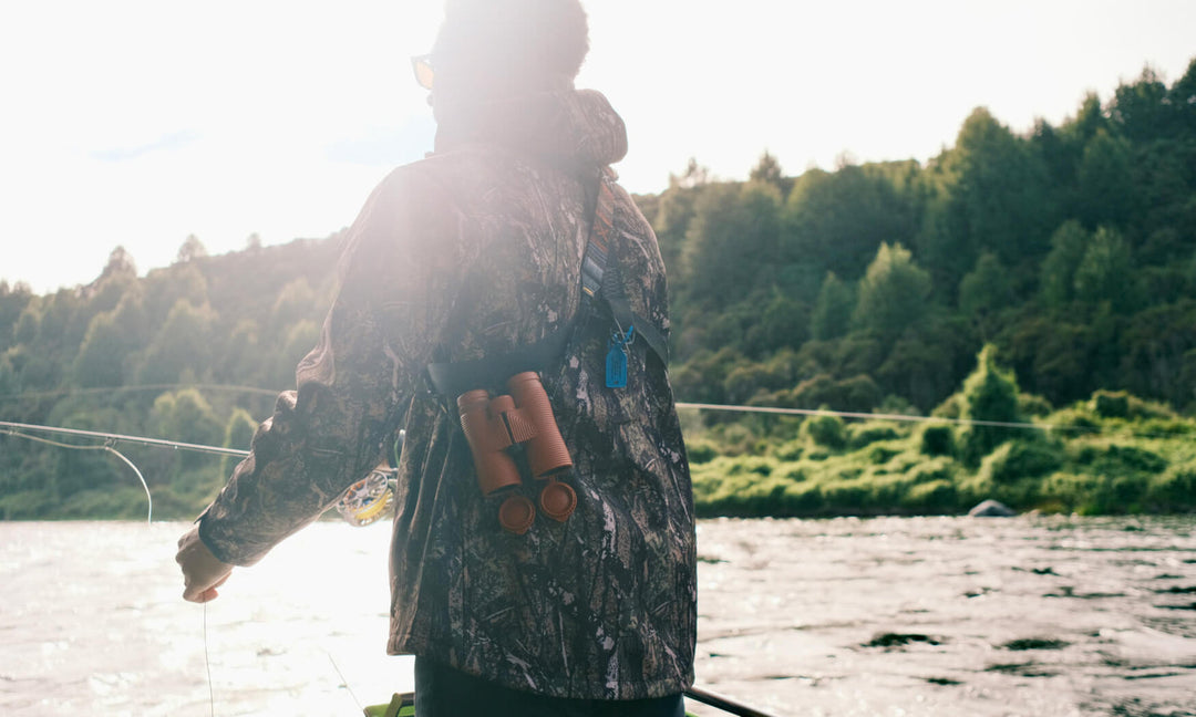 Nocs Provisions Field Issue 10x42 binoculars in Brick Red - lifestyle view